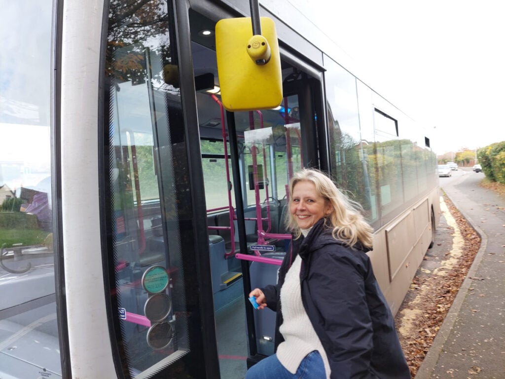 Elena getting on a bus